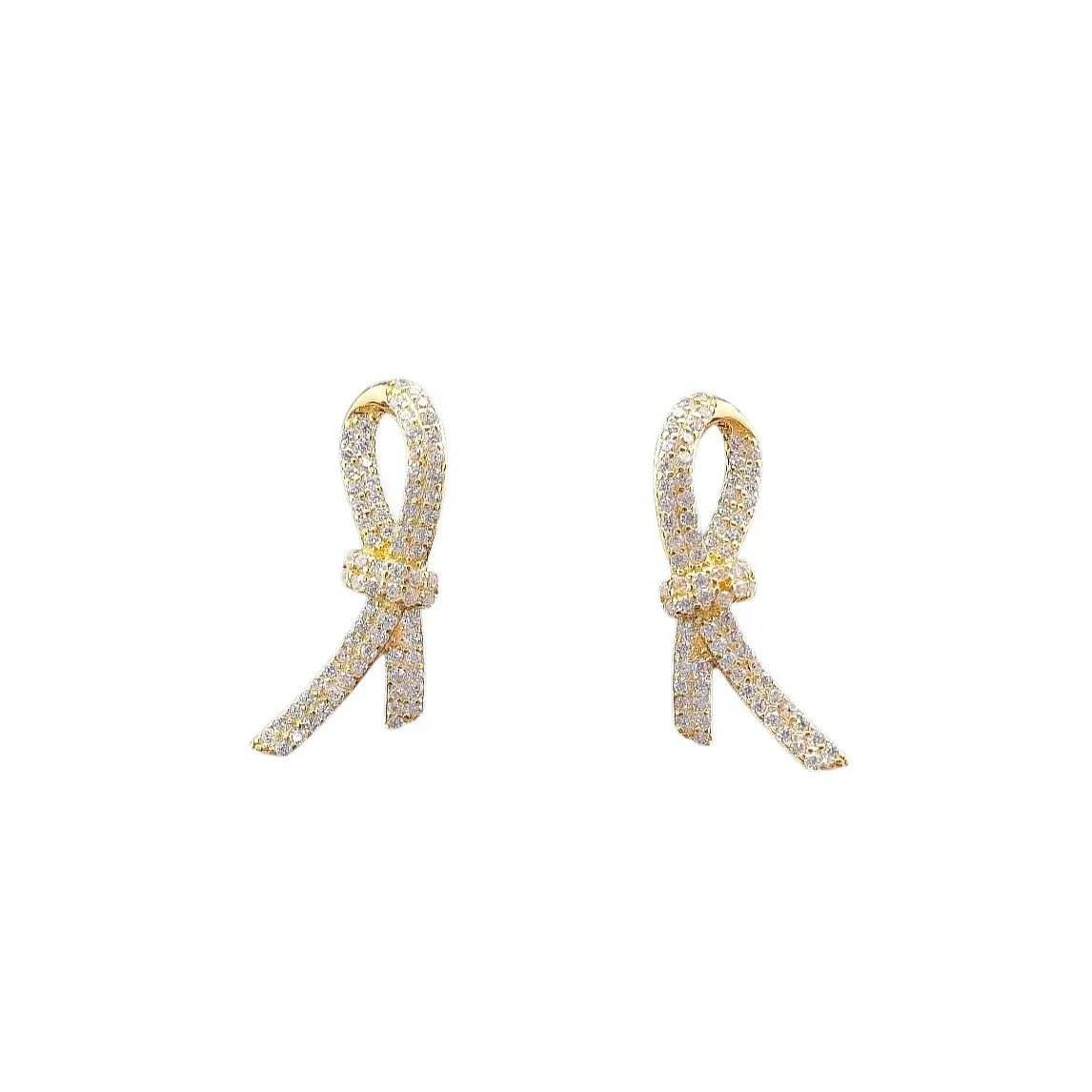Vergulde zilveren ribbon oorbellen met zirkonia stenen - Victoria Valenza