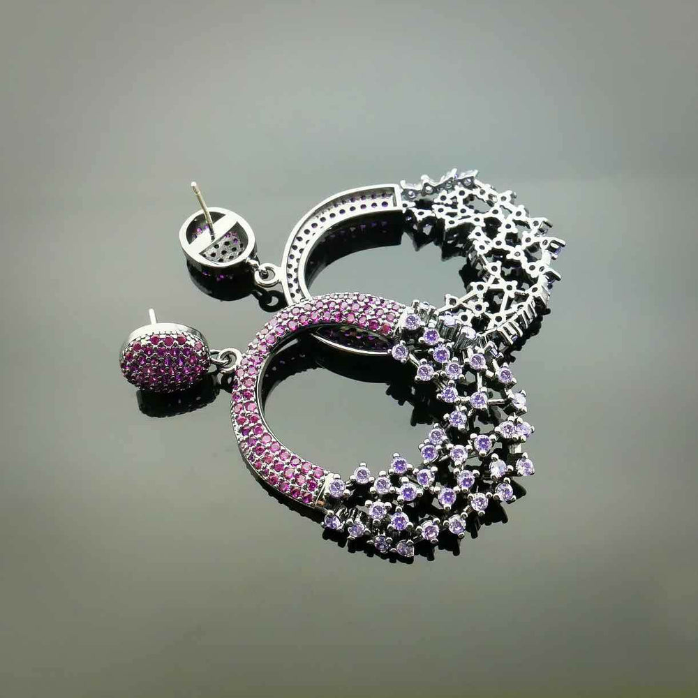 
                      
                        Ovale oorbellen met paarse en roze zirconia's - Victoria Valenza
                      
                    