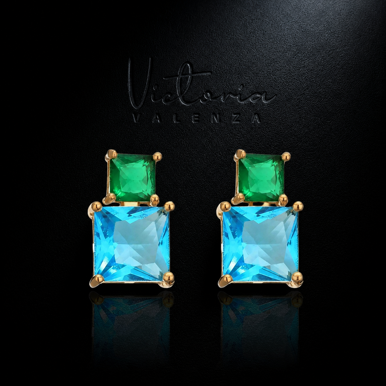 Goudkleurige oorbellen met blauwe en groene zirkonia's | Victoria Valenza