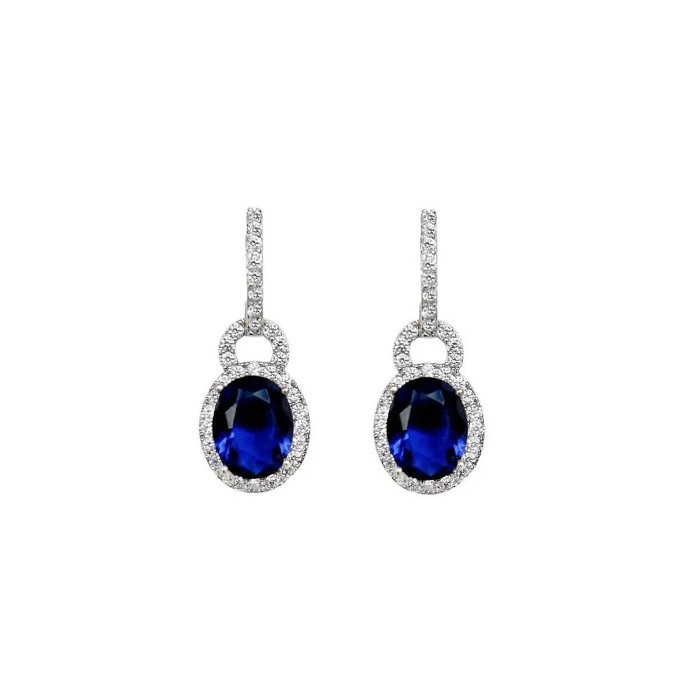 
                      
                        Zilverkleurige oorbellen met blauwe en witte zirkonia's - Victoria Valenza
                      
                    