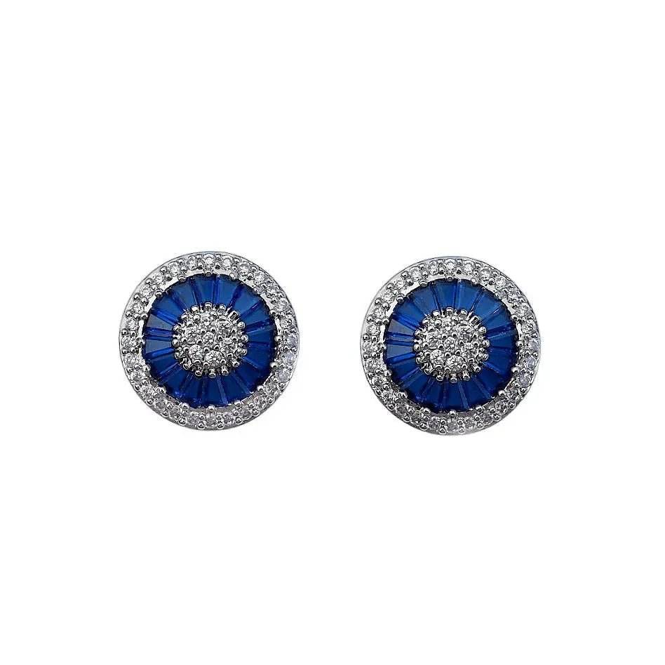 
                      
                        Zilverkleurige Coco oorknoppen met witte en blauwe zirkonia's - Victoria Valenza
                      
                    