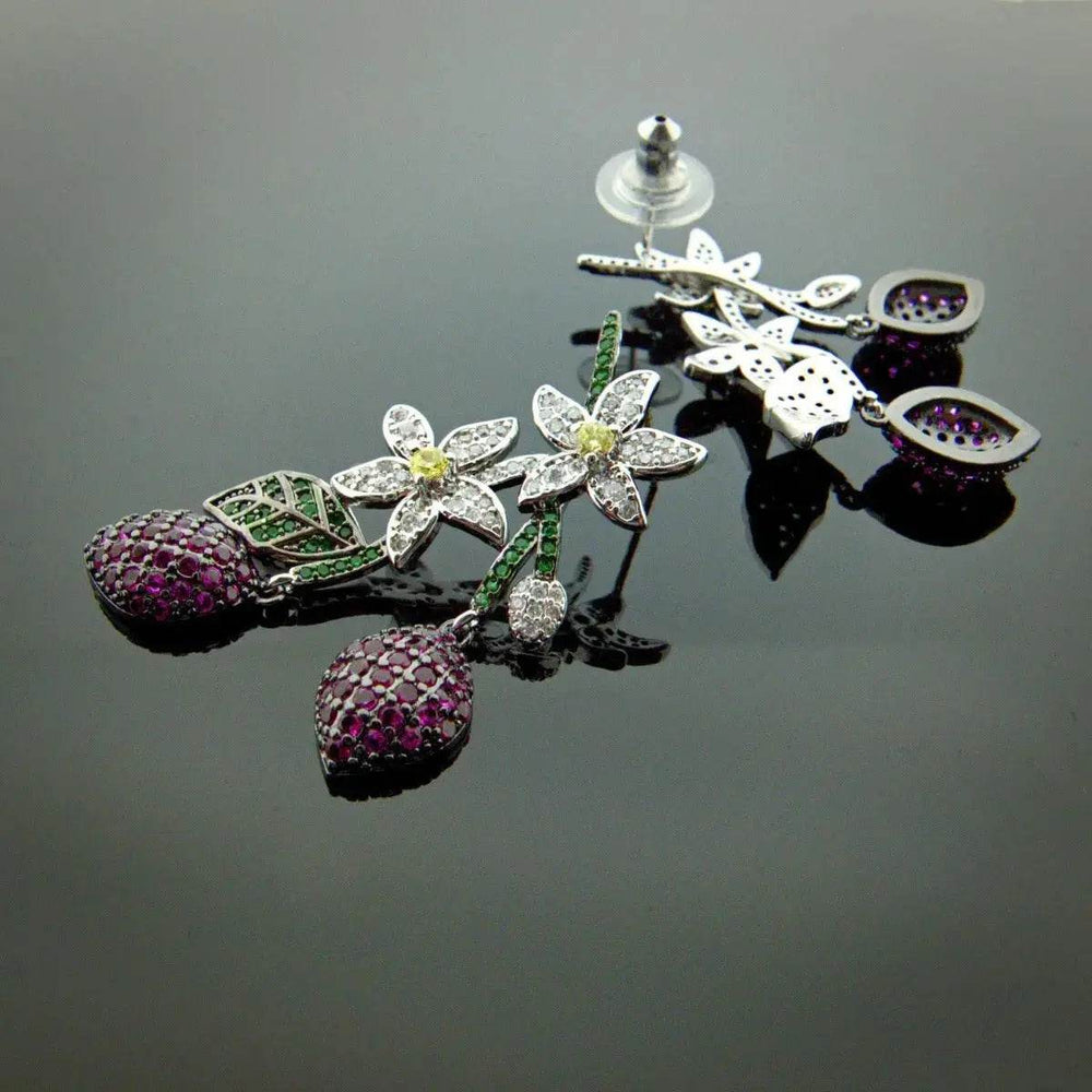 
                      
                        Bloementros oorbellen met multicolor zirkonia's - Victoria Valenza
                      
                    