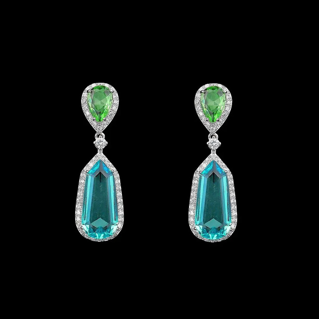 Zilverkleurige fantasie oorbellen met groene en blauwe zirkonia stenen  Victoria Valenza