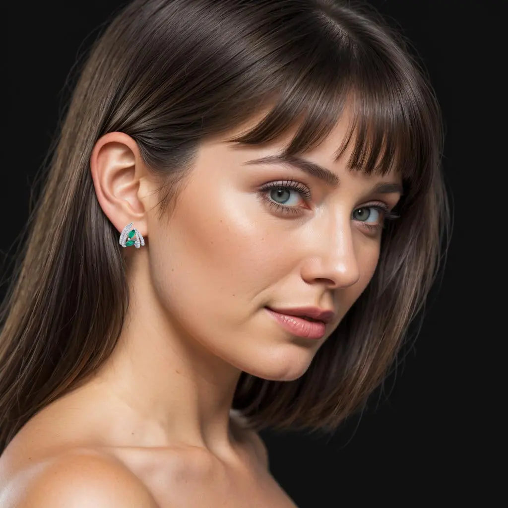 Zilverkleurige oorbellen met groene markies zirkonia stenen  Victoria Valenza