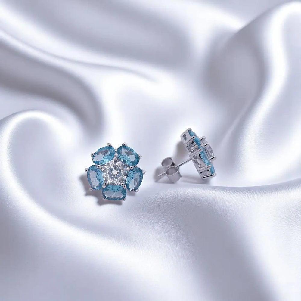 
                      
                        Zilveren bloem oorbellen met blauwe zirkonia stenen  Victoria Valenza
                      
                    