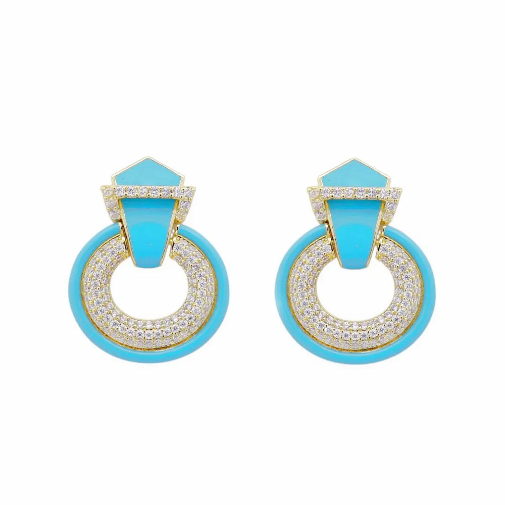 
                      
                        Vergulde ronde oorbellen met zirkonia stenen en turquoise emaille  Victoria Valenza
                      
                    