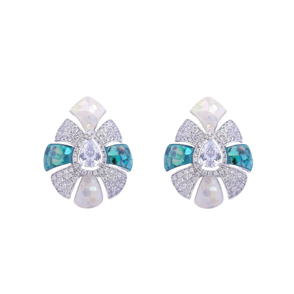 
                      
                        Zilverkleurige gerhodineerde druppel oorbellen met blauw-groene en witte parelmoer en witte zirkonia stenen  Victoria Valenza
                      
                    