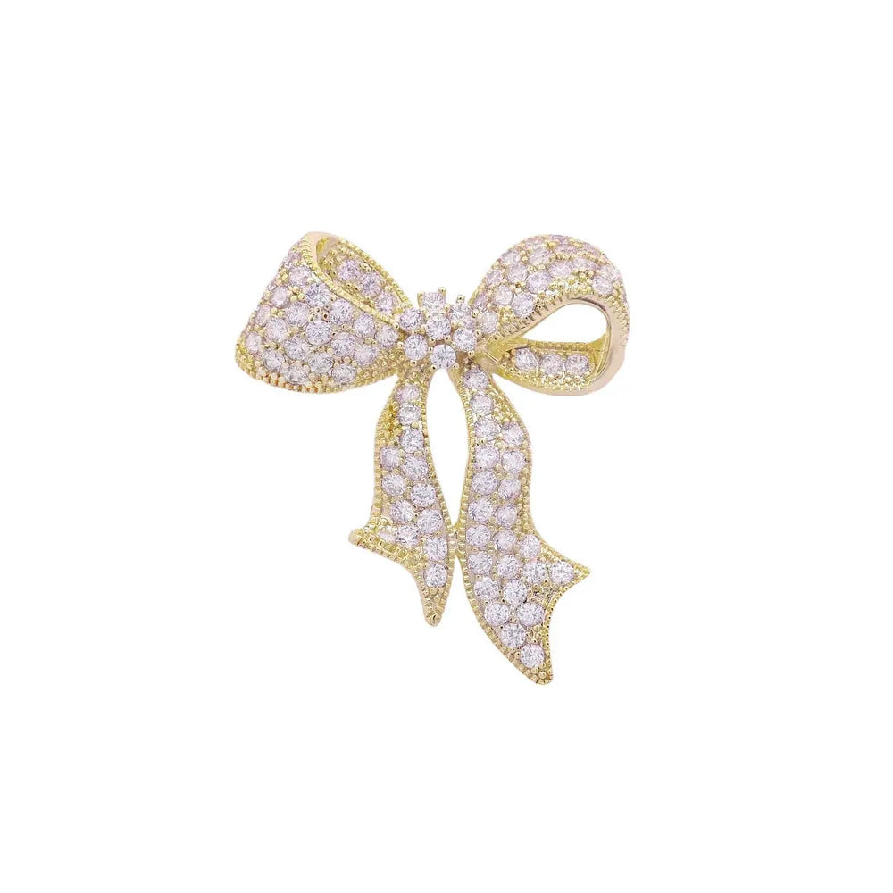 
                      
                        Goudkleurige strik broche met zirkonia stenen  Victoria Valenza
                      
                    