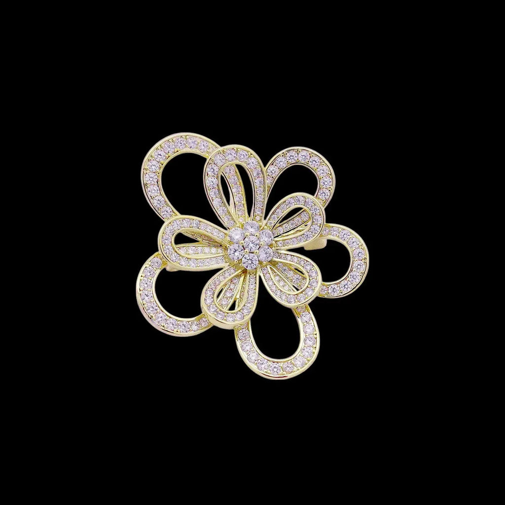 Goudkleurige cosmosbloem broche tevens hanger met zirkonia stenen  Victoria Valenza