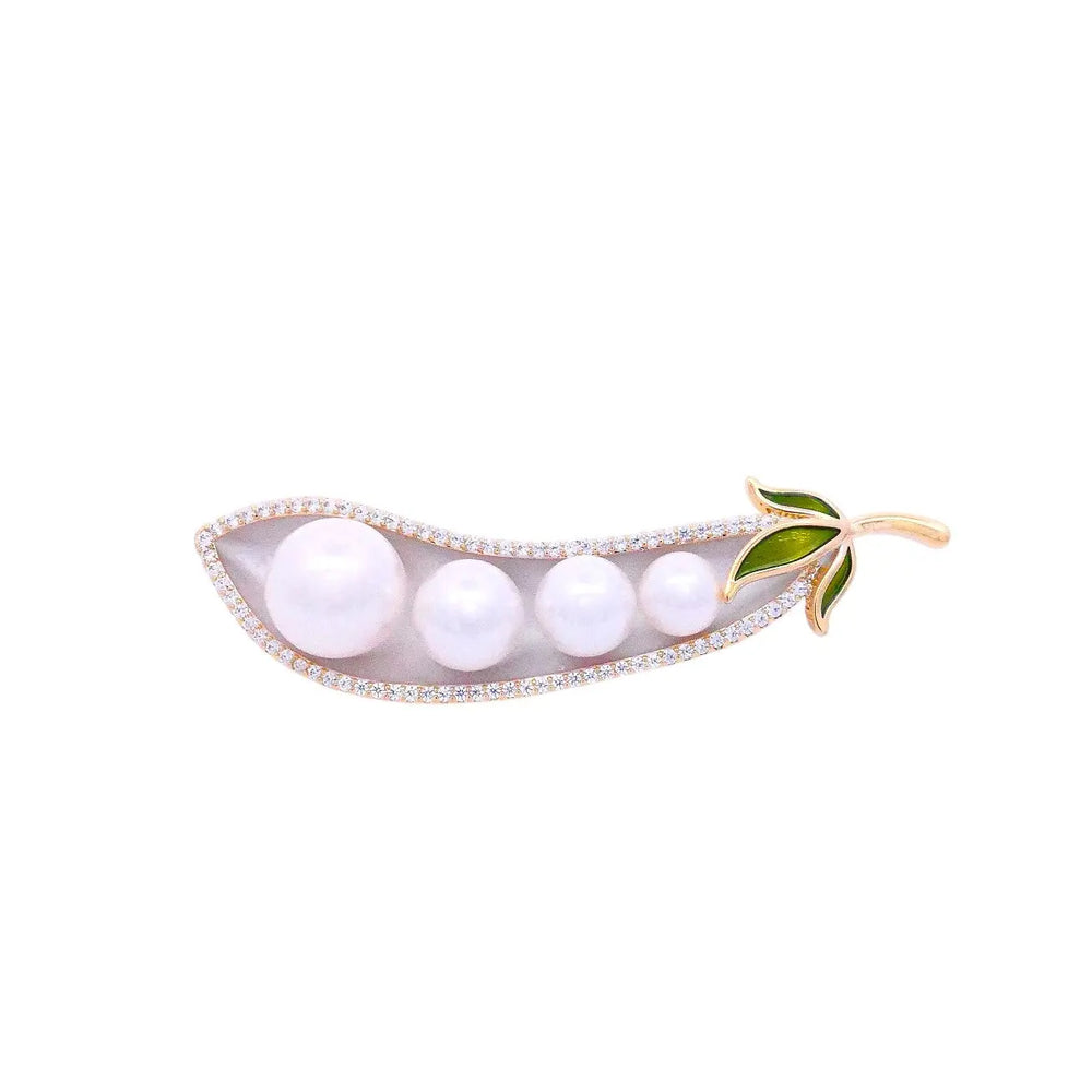 
                      
                        Goudkleurige boontje broche met parels, zirkonia stenen en emaille  Victoria Valenza
                      
                    