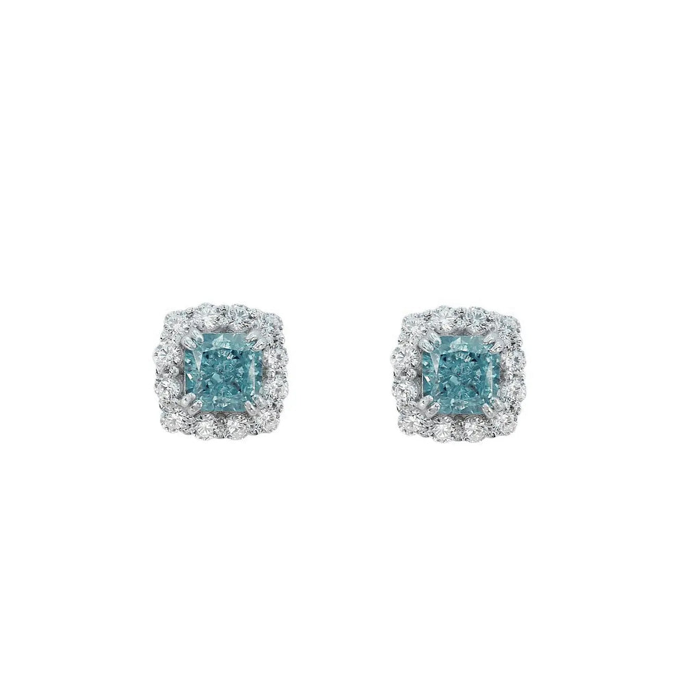 
                      
                        Zilveren cushion entourage oorbellen met blauwe zirkonia stenen  Victoria Valenza
                      
                    