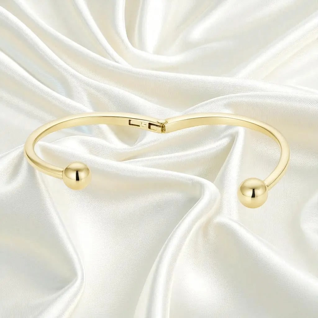 Goudkleurige slagarmband met bolletjes  Victoria Valenza