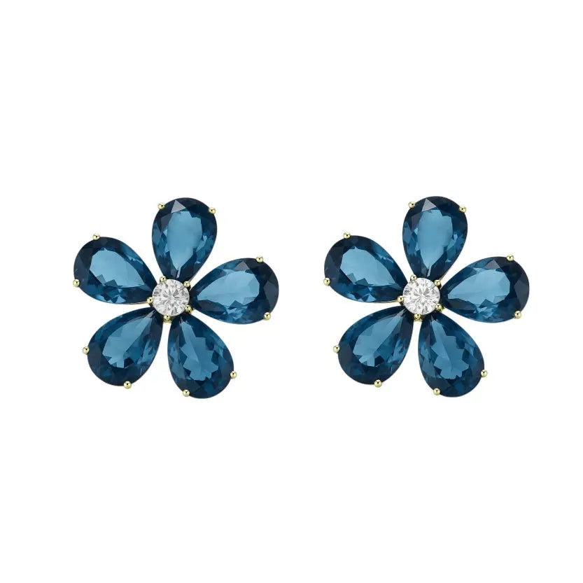 
                      
                        Goudkleurige bloem oorbellen met blauwe zirkonia stenen  Victoria Valenza
                      
                    