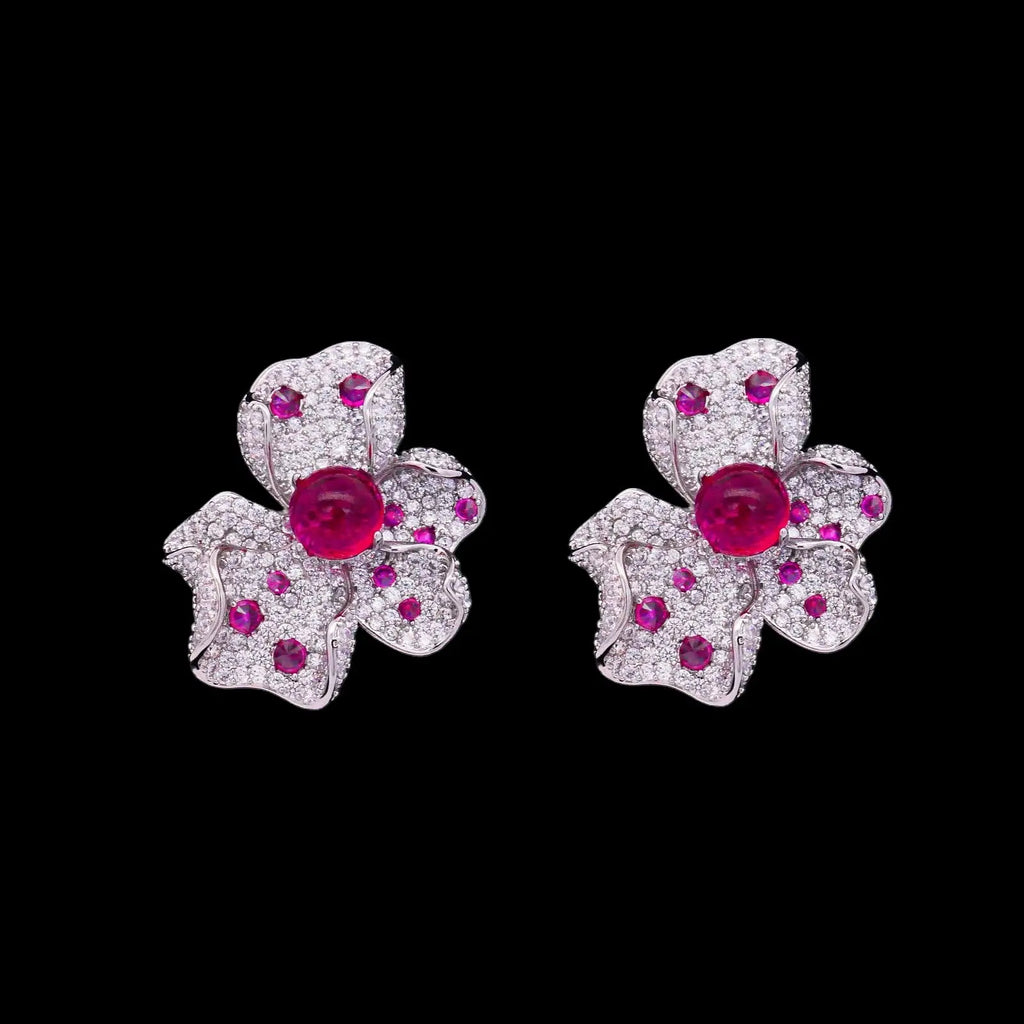 Zilverkleurige orchidee oorbellen met roze zirkonia stenen  Victoria Valenza