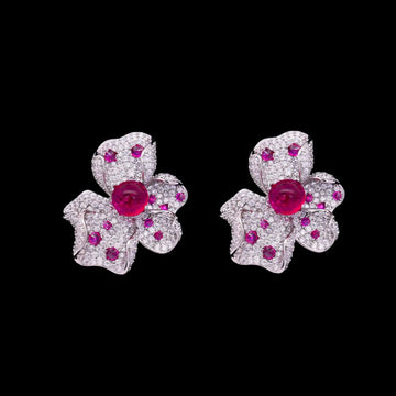 Zilverkleurige orchidee oorbellen met roze zirkonia stenen  Victoria Valenza