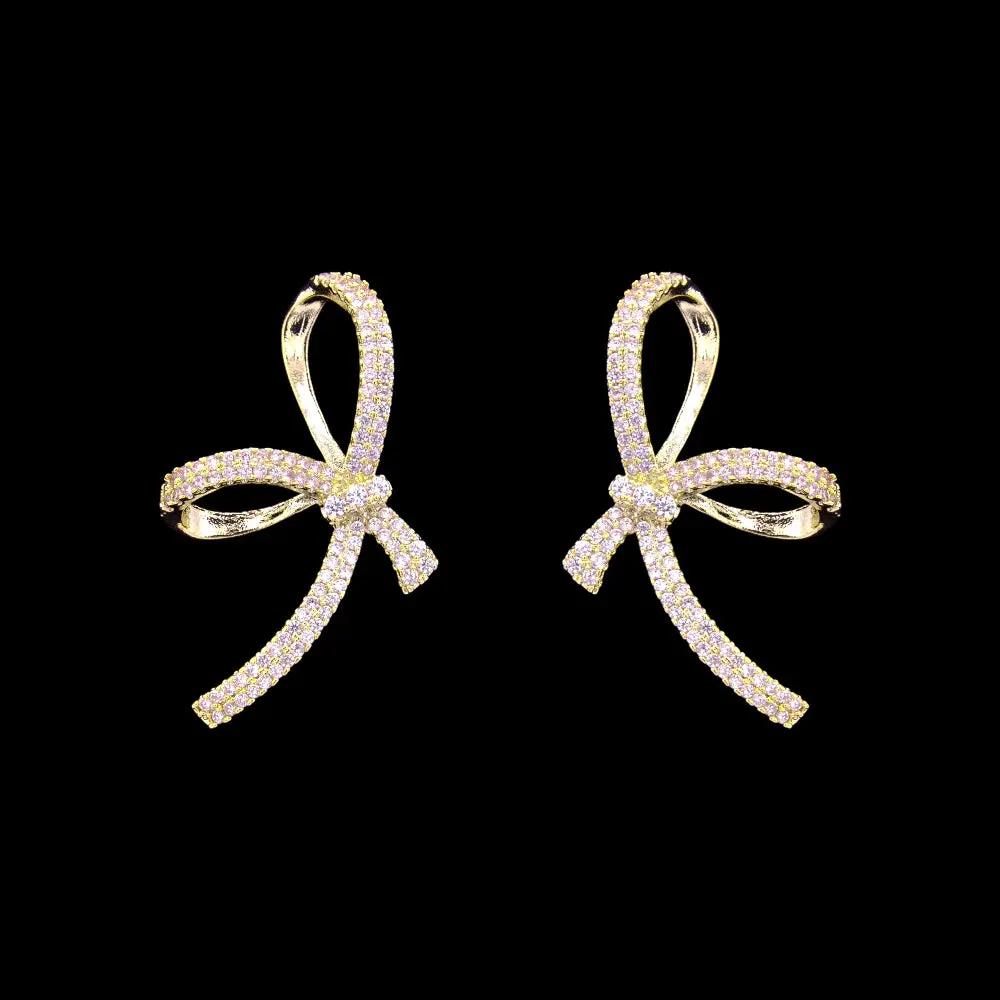 Goudkleurige grote strik oorbellen met zirkonia stenen  Victoria Valenza