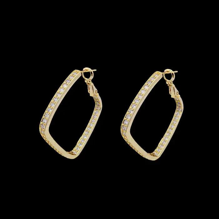 Goudkleurige ruit oorbellen met zirkonia stenen  Victoria Valenza