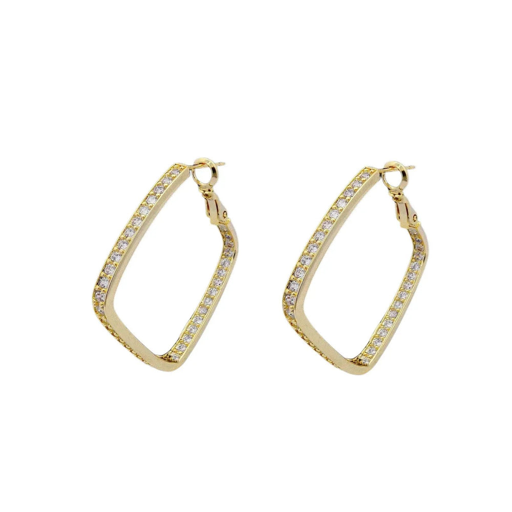 
                      
                        Goudkleurige ruit oorbellen met zirkonia stenen  Victoria Valenza
                      
                    