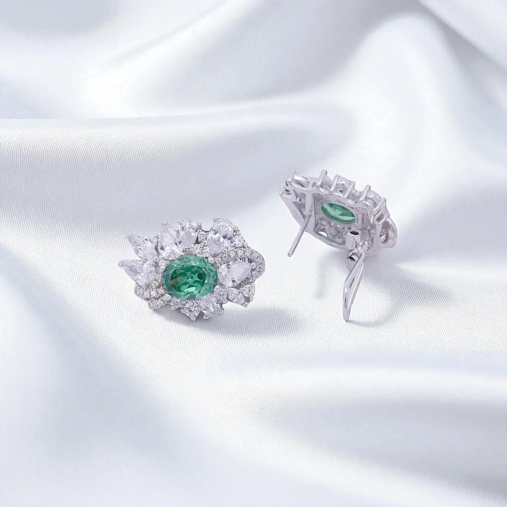 
                      
                        Zilveren cluster oorbellen met groene zirkonia stenen  Victoria Valenza
                      
                    