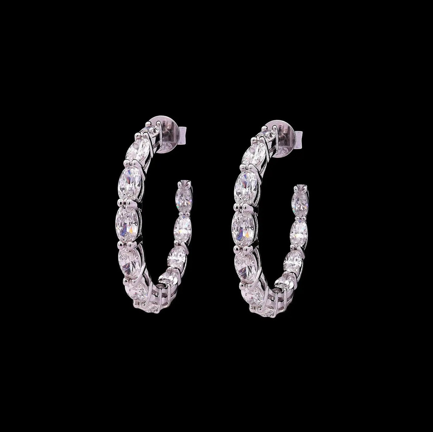 Zilveren creolen met ovale zirkonia stenen  Victoria Valenza