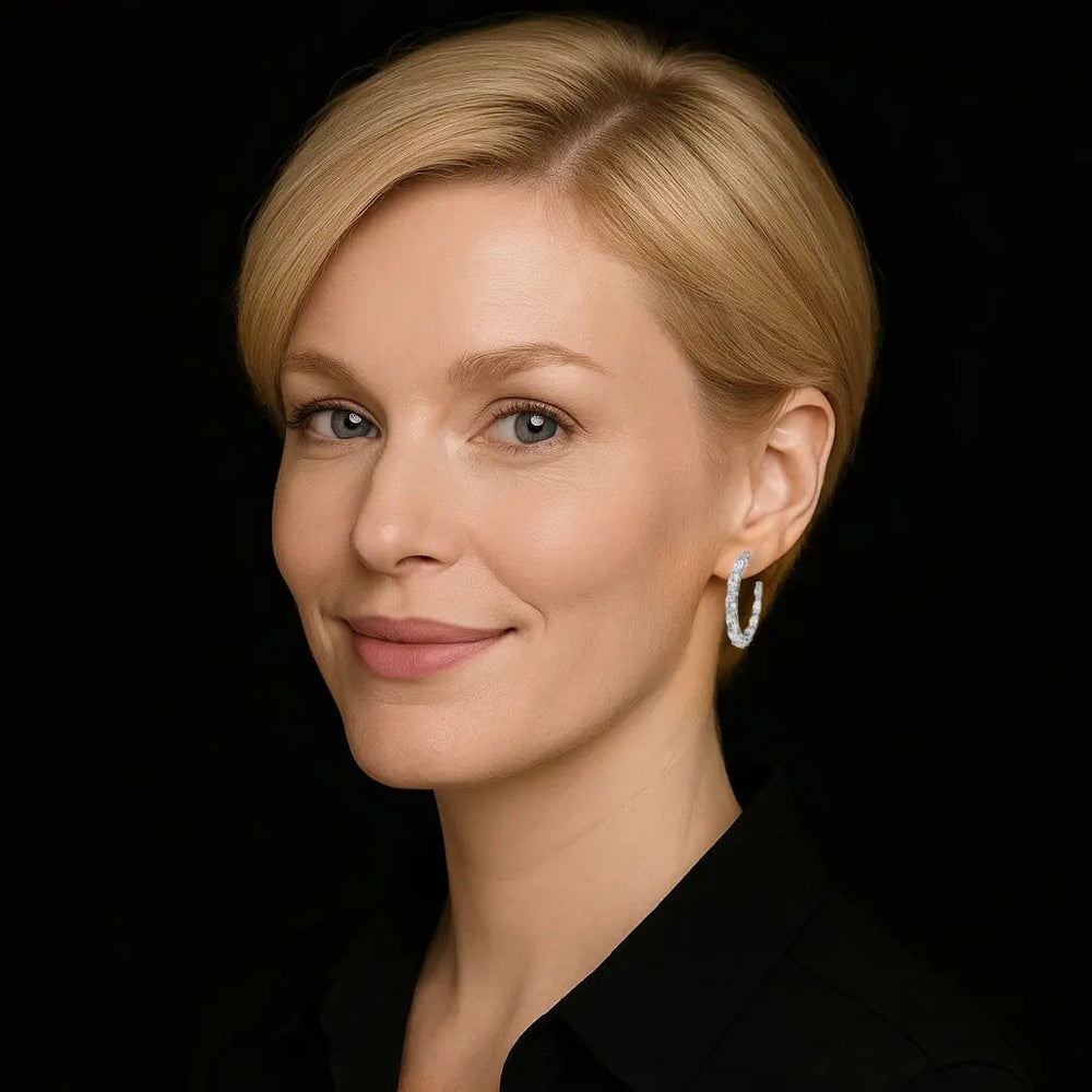 Zilveren creolen met ovale zirkonia stenen  Victoria Valenza