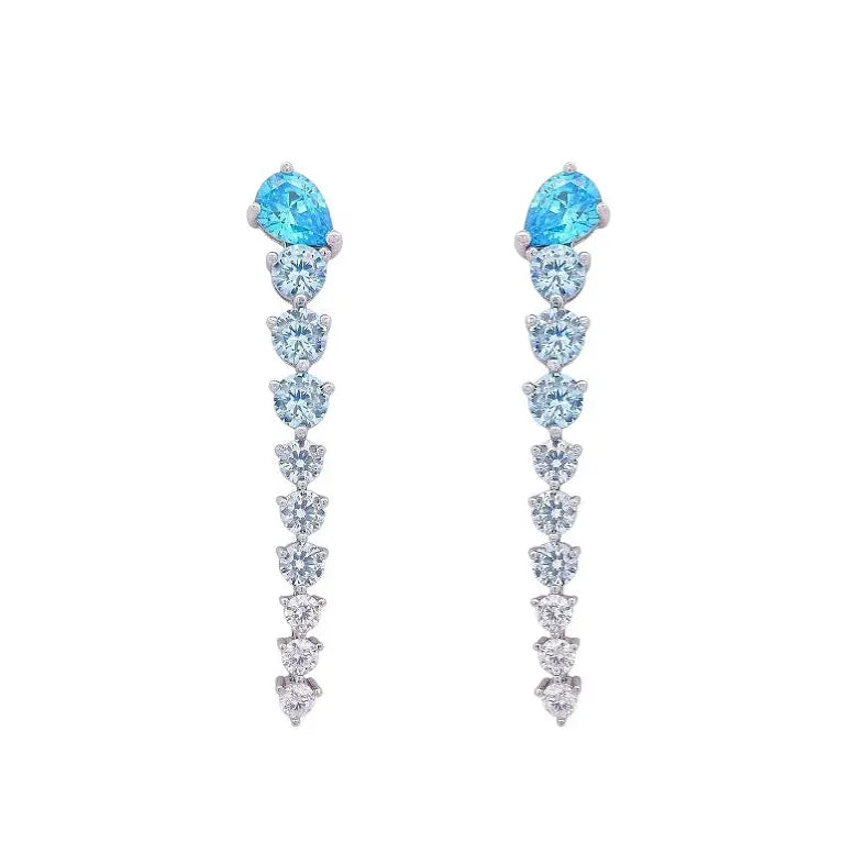 
                      
                        Zilveren lange oorbellen met turquoise zirkonia's  Victoria Valenza
                      
                    