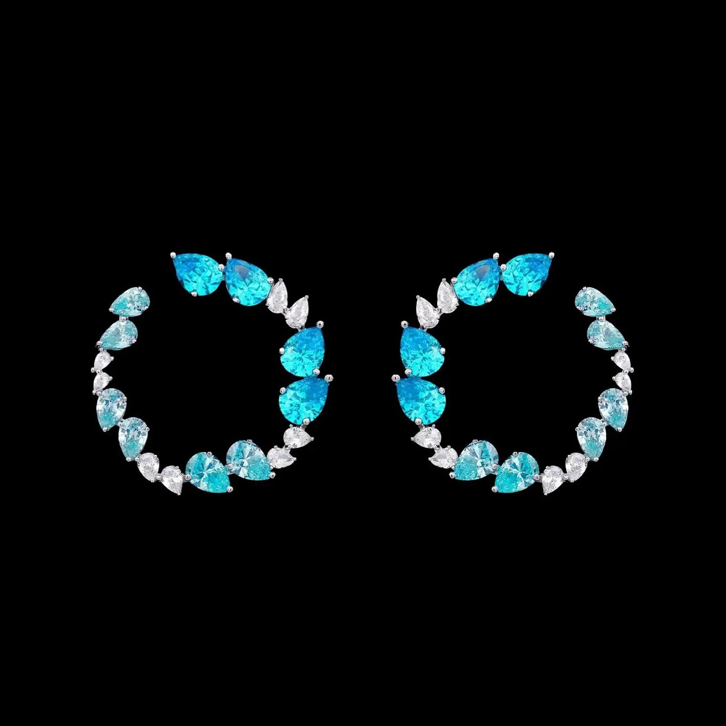 Zilveren fantasie cirkel oorbellen met turquoise zirkonia stenen  Victoria Valenza