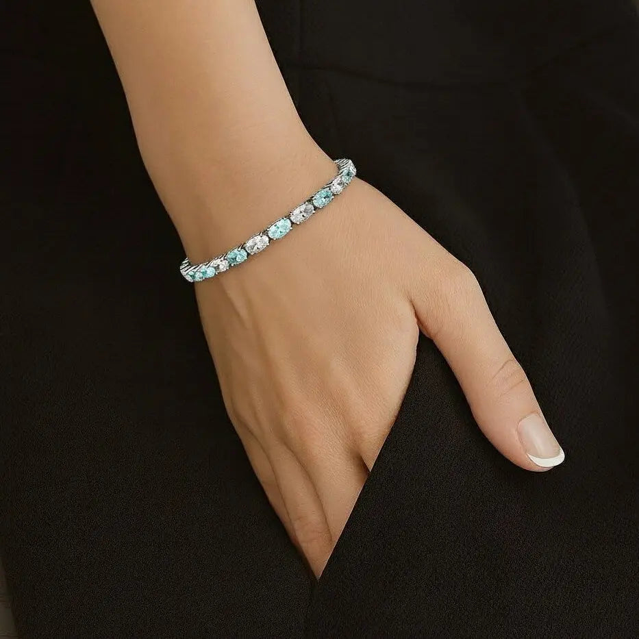 Zilveren armband met aquamarijnkleurige zirkonia stenen  Victoria Valenza