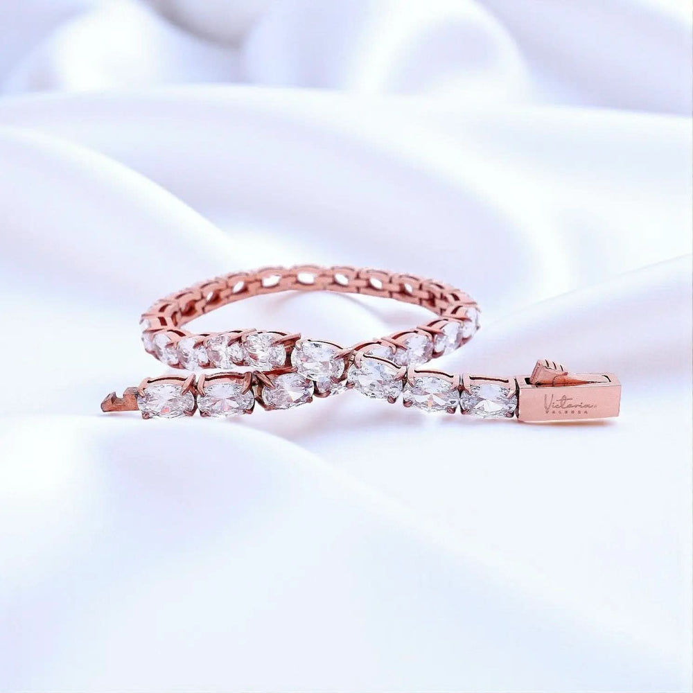 
                      
                        Roségoudkleurige RVS tennisarmband 18,3 cm met ovale zirkonia stenen  Victoria Valenza
                      
                    