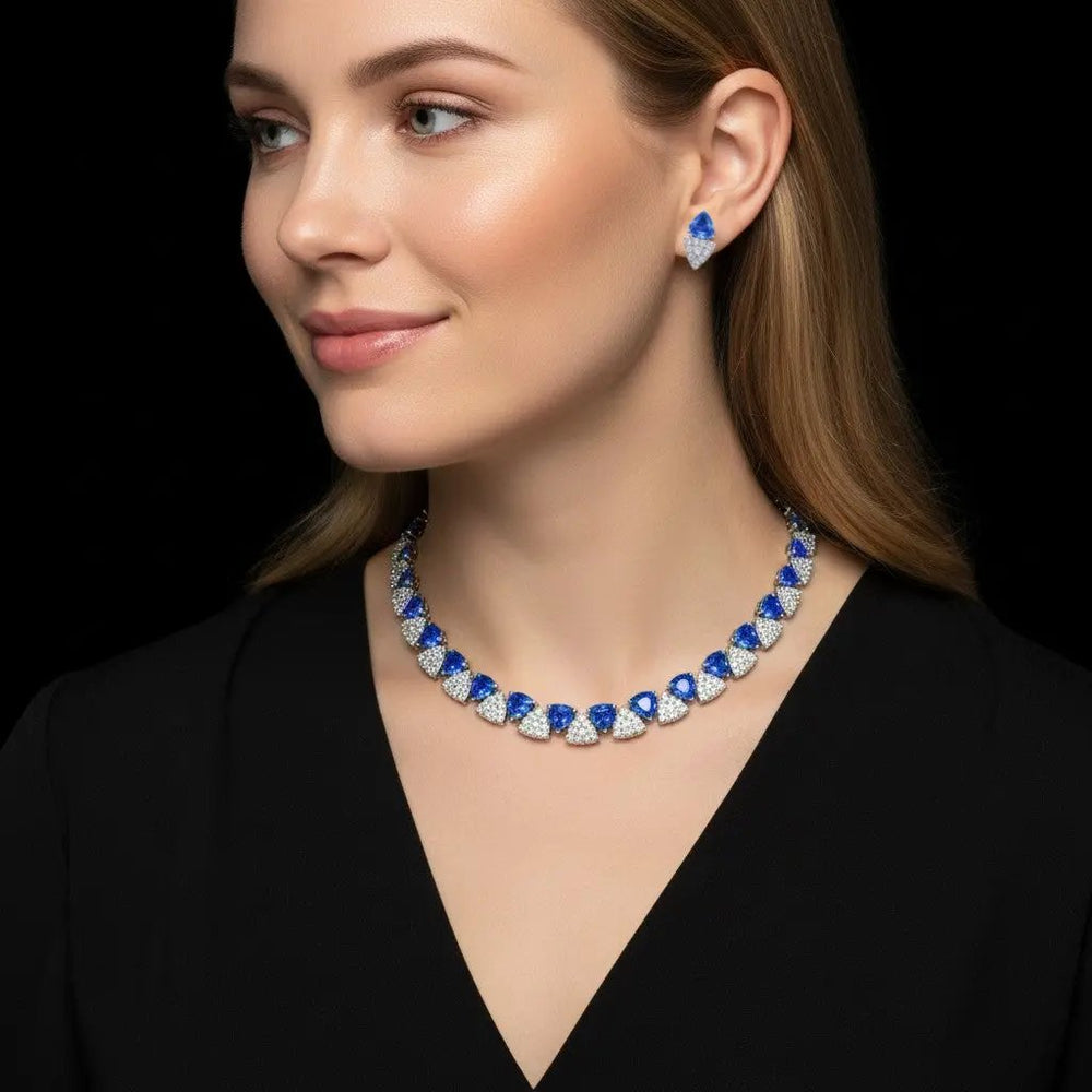 Zilverkleurige collier en oorbellen met blauwe zirkonia stenen  Victoria Valenza