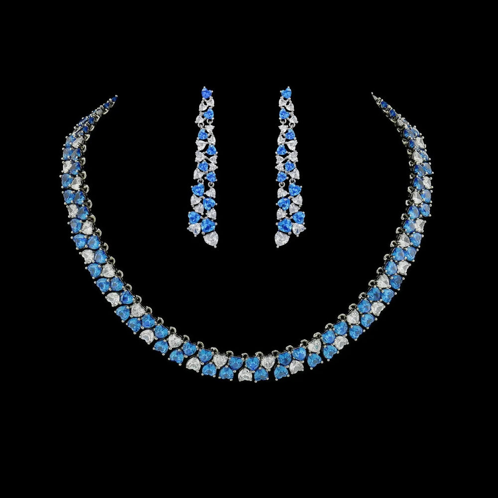Zilverkleurige collier en oorbellen met blauwe hartvormige zirkonia stenen  Victoria Valenza