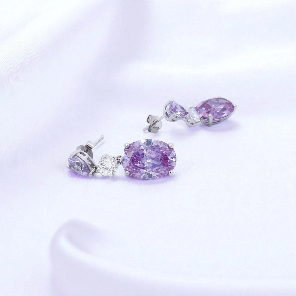 
                      
                        Zilveren oorbellen met paarse zirkonia stenen  Victoria Valenza
                      
                    