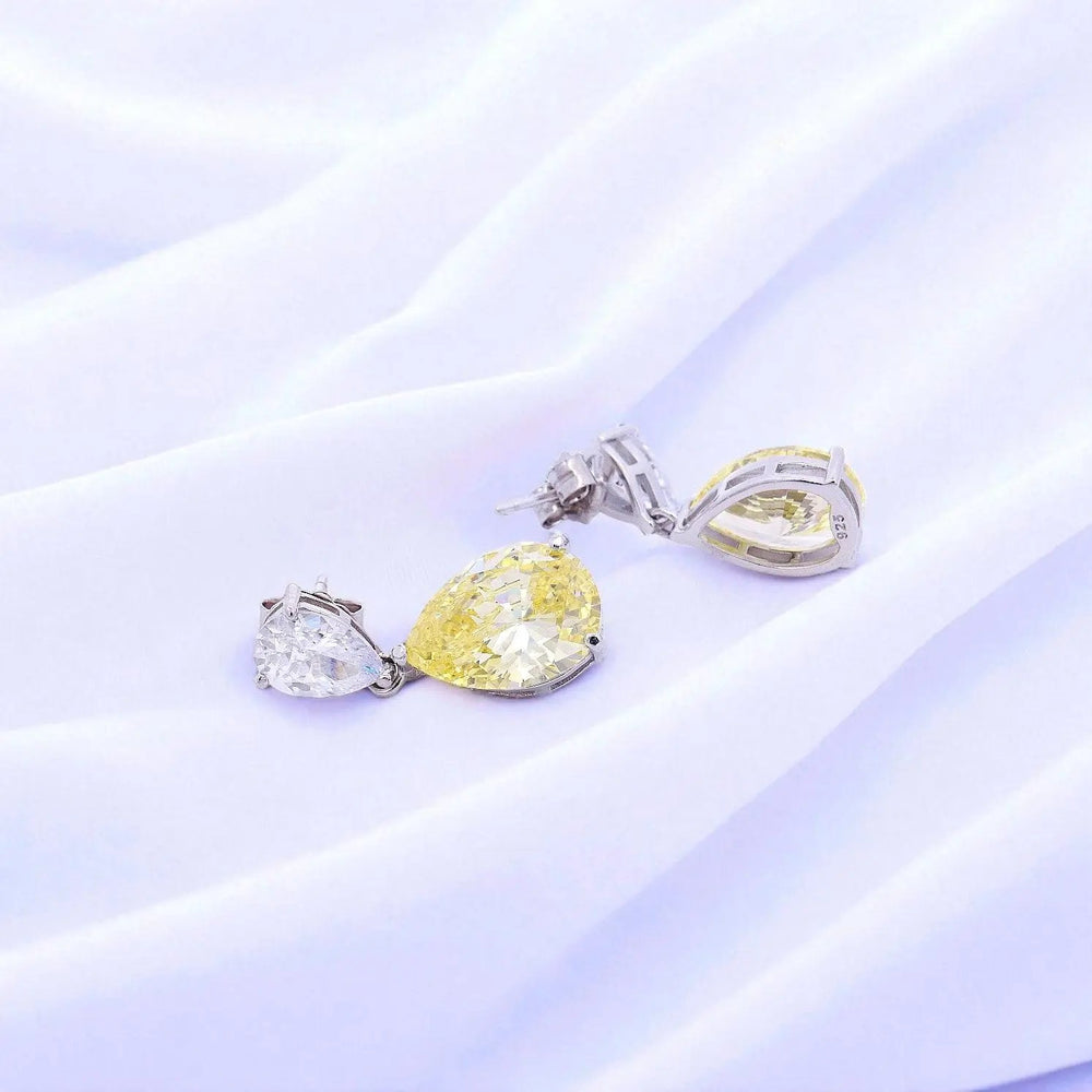 
                      
                        Zilveren druppel oorbellen met gele zirkonia stenen  Victoria Valenza
                      
                    