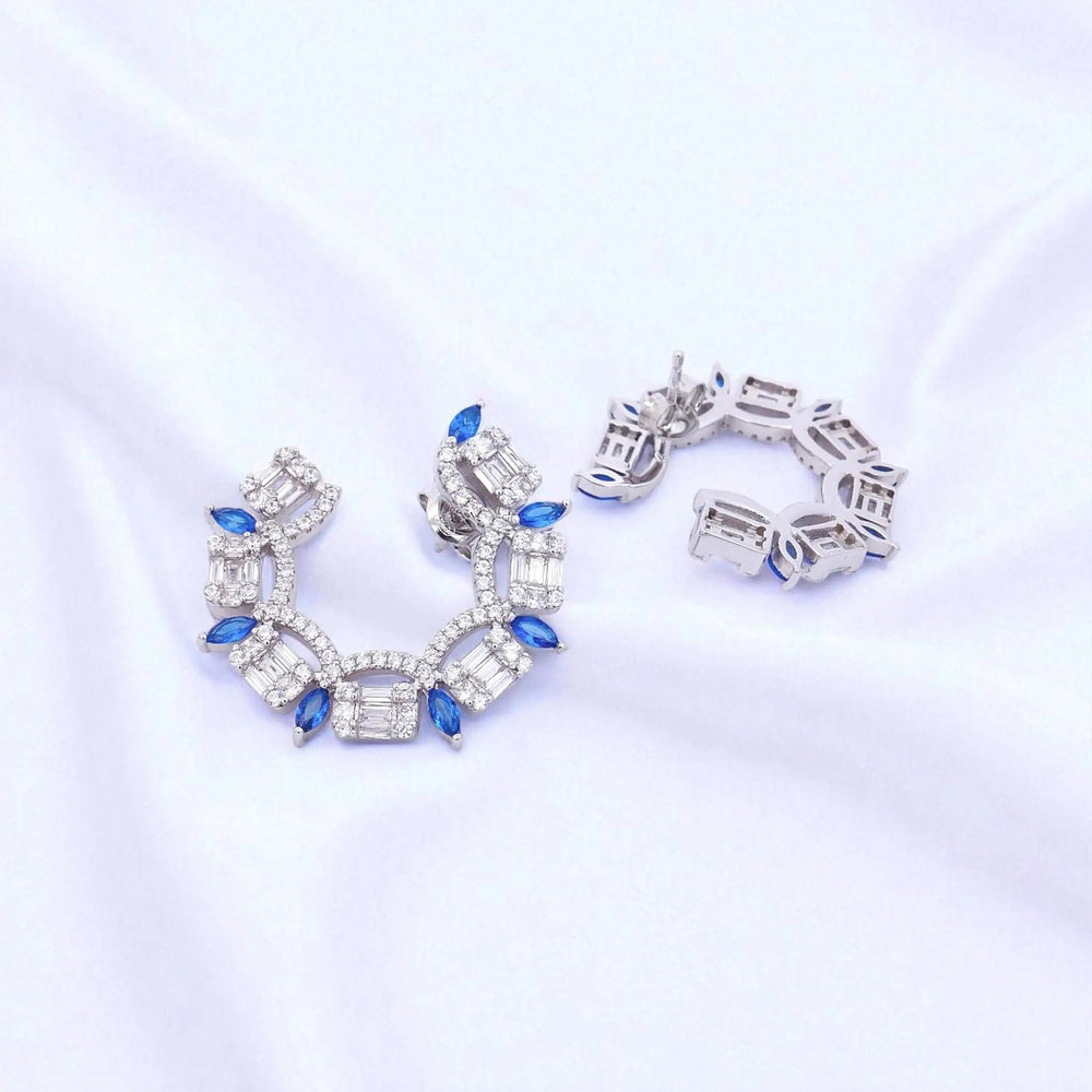 
                      
                        Zilveren waaier oorbellen met bauwe zirkonia stenen  Victoria Valenza
                      
                    