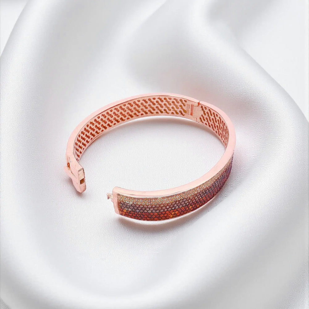 
                      
                        Roségoud vergulde zilveren armband met oranje en bruine zirkonia stenen  Victoria Valenza
                      
                    