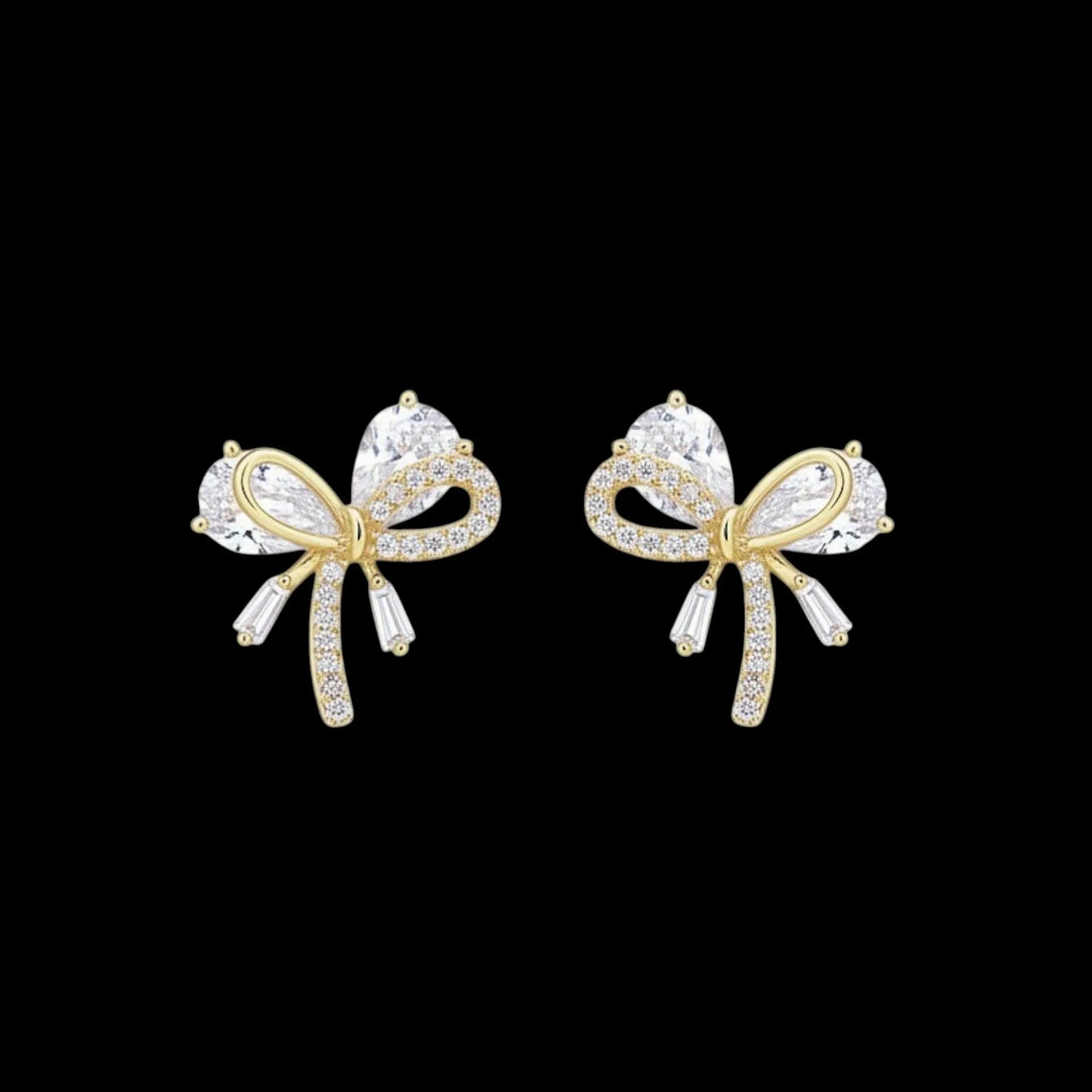 Goudkleurige kleine strik oorbellen met zirkonia stenen  Victoria Valenza