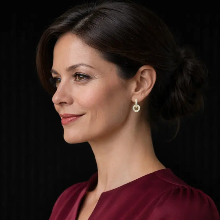 Goudkleurige cirkel oorbellen met zirkonia stenen  Victoria Valenza