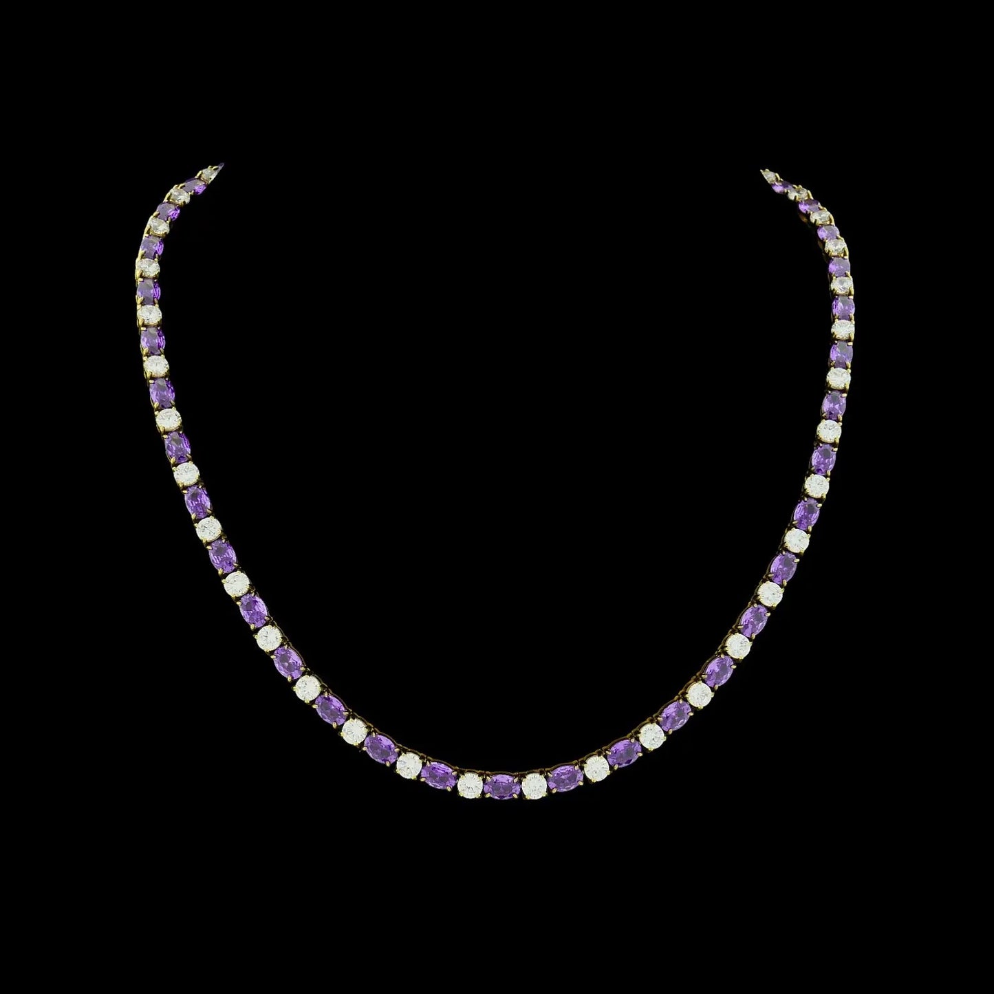 Goudkleurig RVS tenniscollier met ovale paarse zirkonia stenen 4 mm