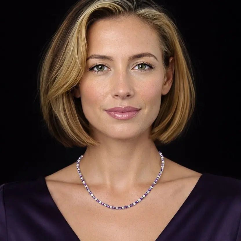 Goudkleurig RVS tenniscollier met ovale paarse zirkonia stenen 4 mm