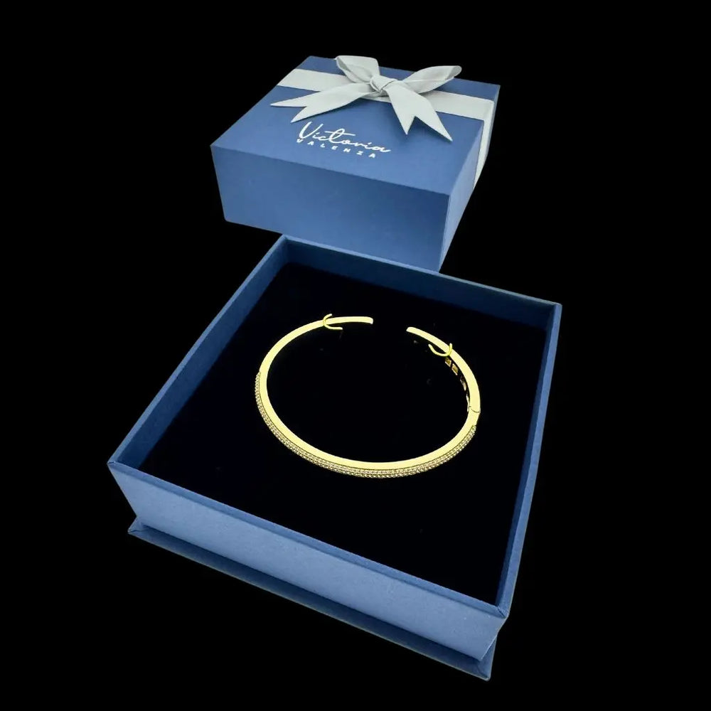
                      
                        Goudkleurige armband met scharnier en pavé zirkonia  Victoria Valenza
                      
                    