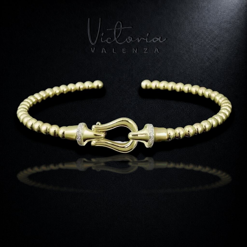 Goudkleurige Bolletjes Flexarmband met Haaksluiting en Zirkonia Stenen | Victoria Valenza