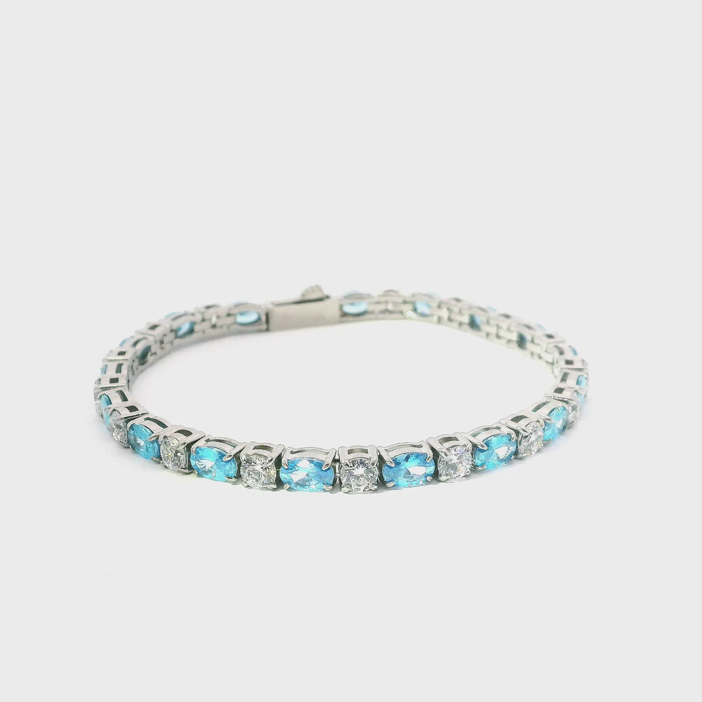 
                      
                        Charger et lire la vidéo dans la visionneuse de la galerie, Bracelet tennis en acier inoxydable avec pierres de zircone bleues et blanches
                      
                    