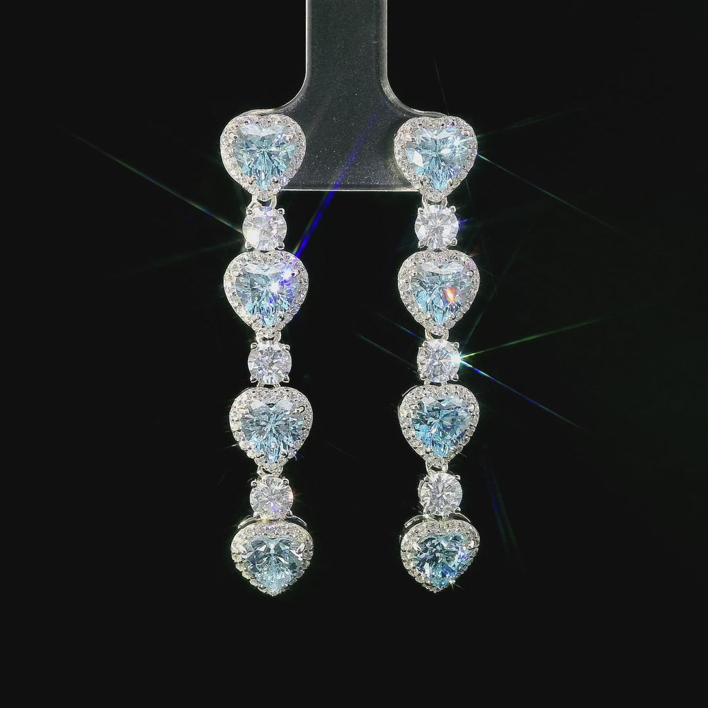 
                      
                        Charger et lire la vidéo dans la visionneuse de la galerie, Boucles d&amp;#39;oreilles longues en argent avec pierres en zircone bleue
                      
                    