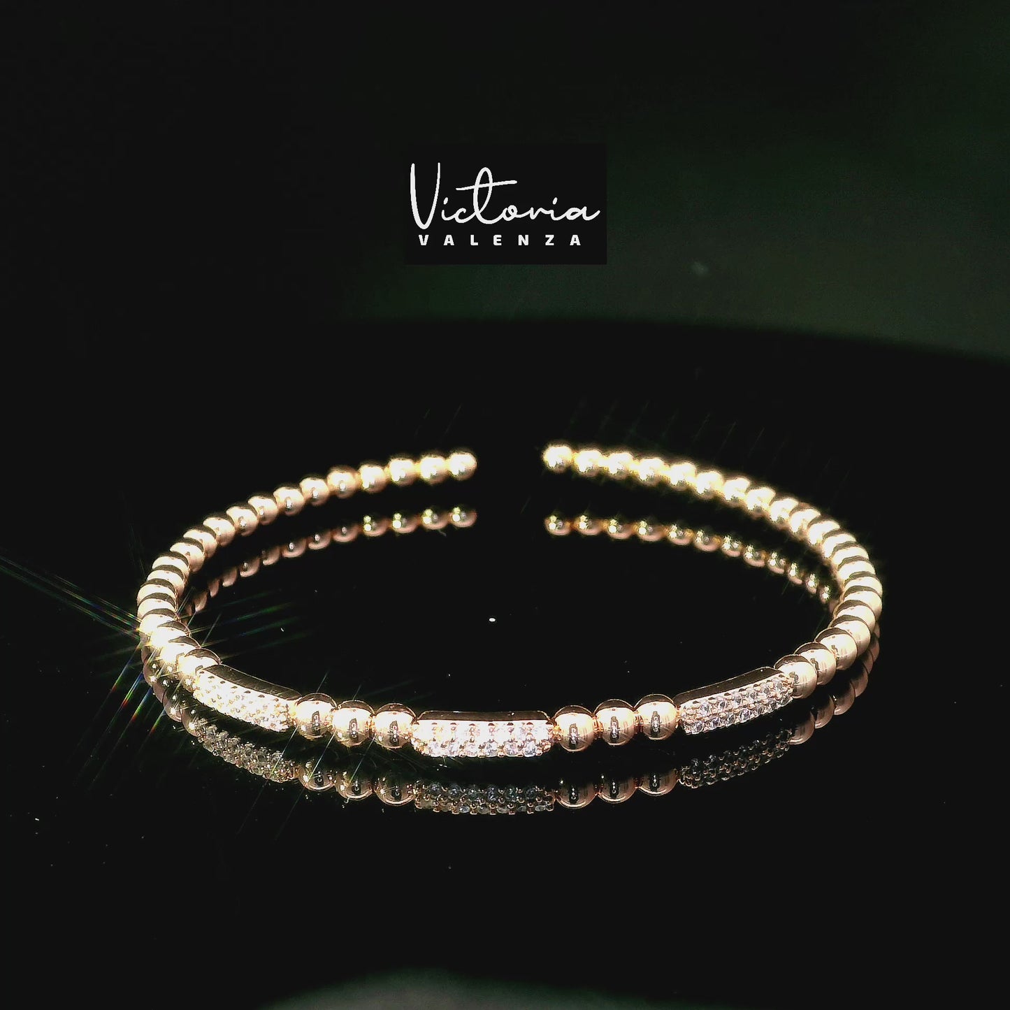 Bracelet flexible à billes couleur or rose avec pierres en zircone