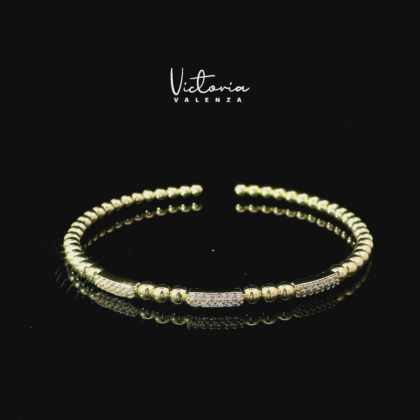 Bracelet flexible à billes couleur or avec pierres en zircone