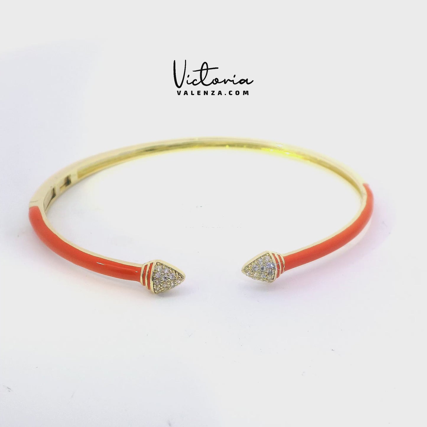 Bracelet couleur or avec émail orange et pierres de zircone